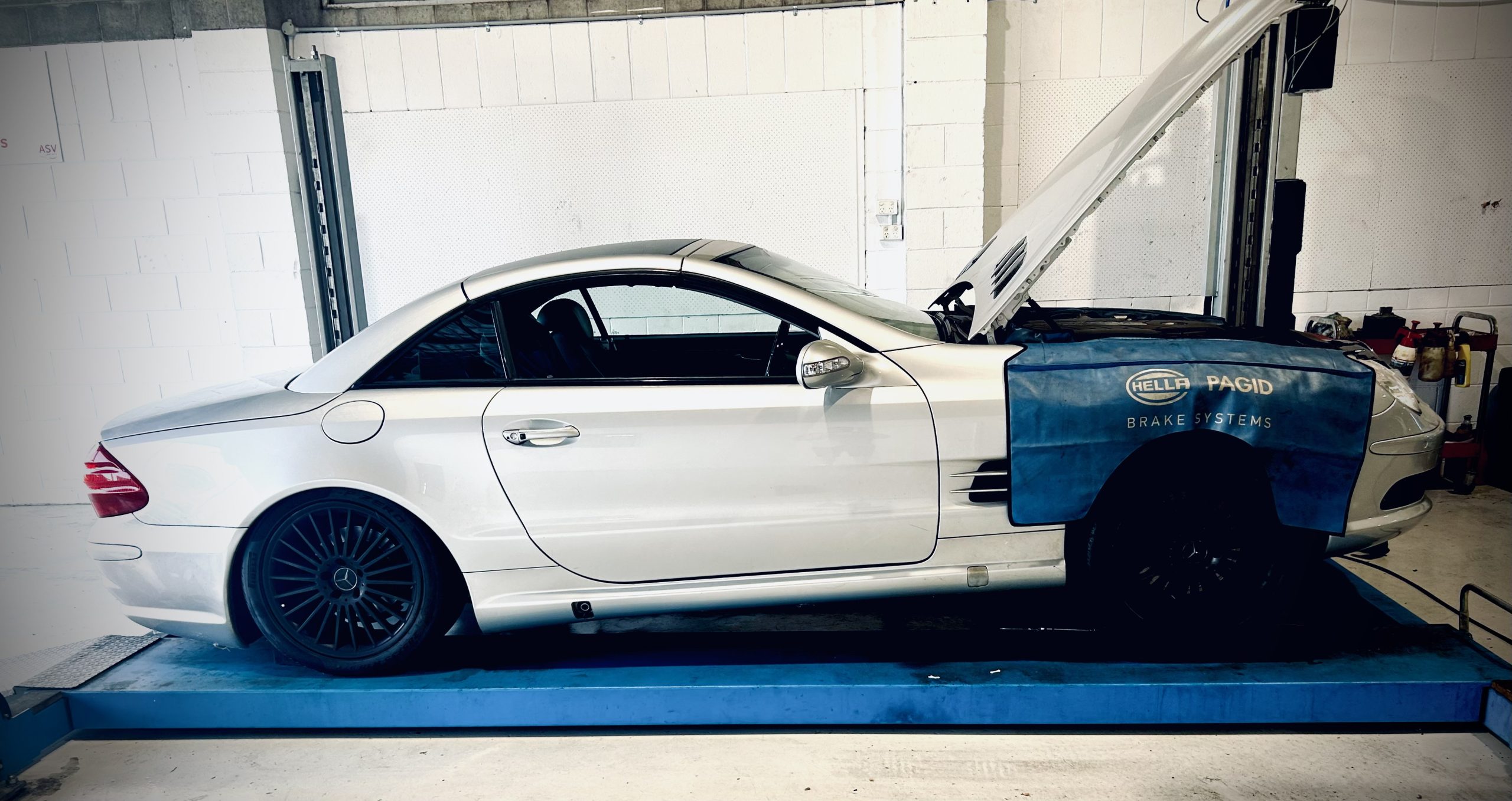 Mercedes-Benz with the bonnet up in the North Star Motors workshop